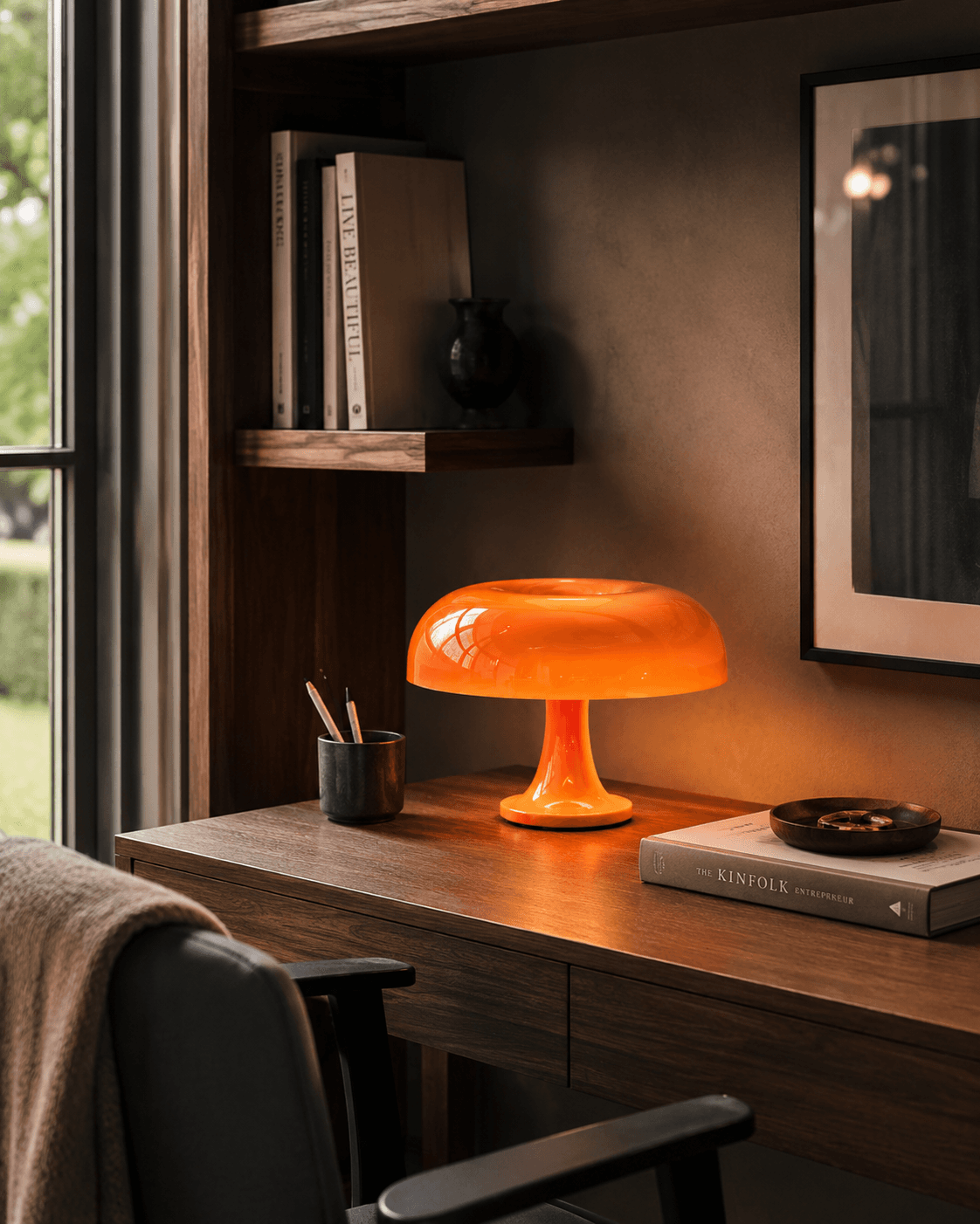 Dimmable LED mushroom table lamp glowing warmly on a dark surface